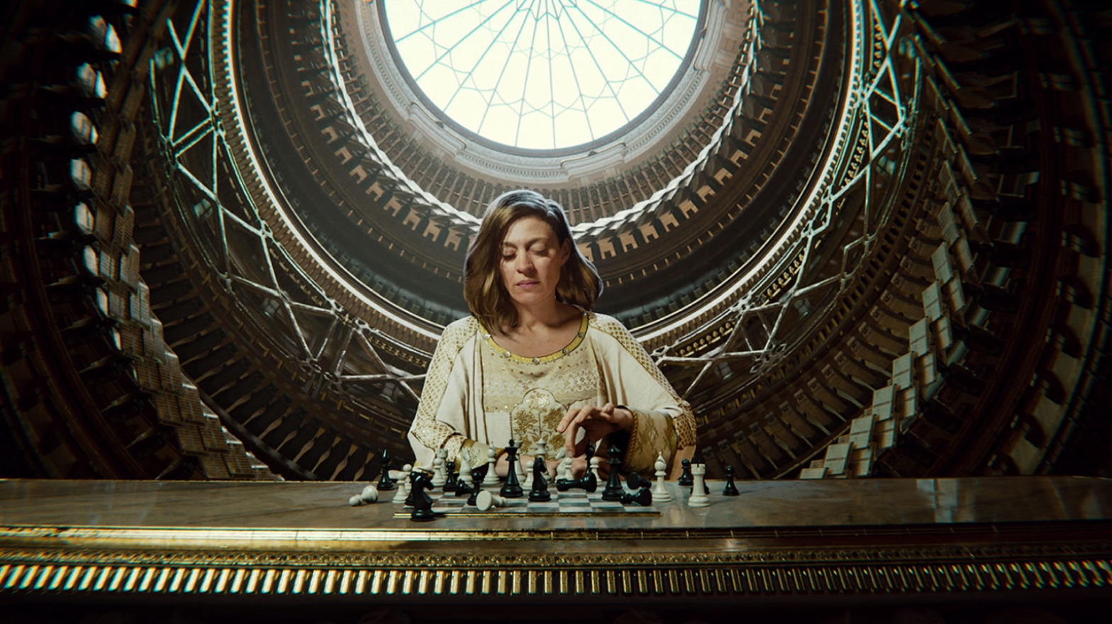person sitting at a table playing chess