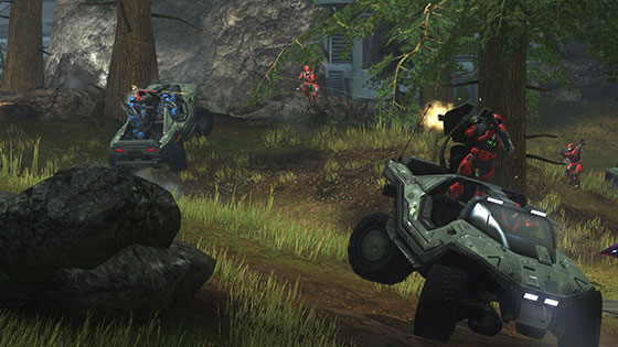Spartans in Halo driving vehicles through a grassy field