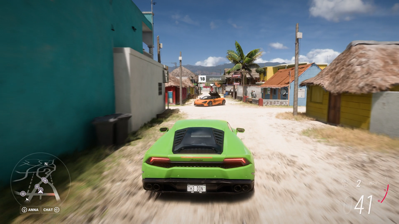 Green Forza car racing through streets of Mexico