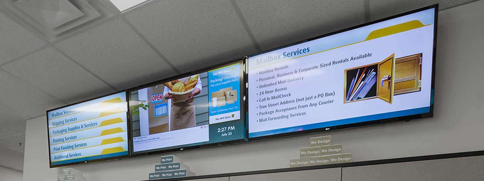 Digital signs displayed in a UPS store